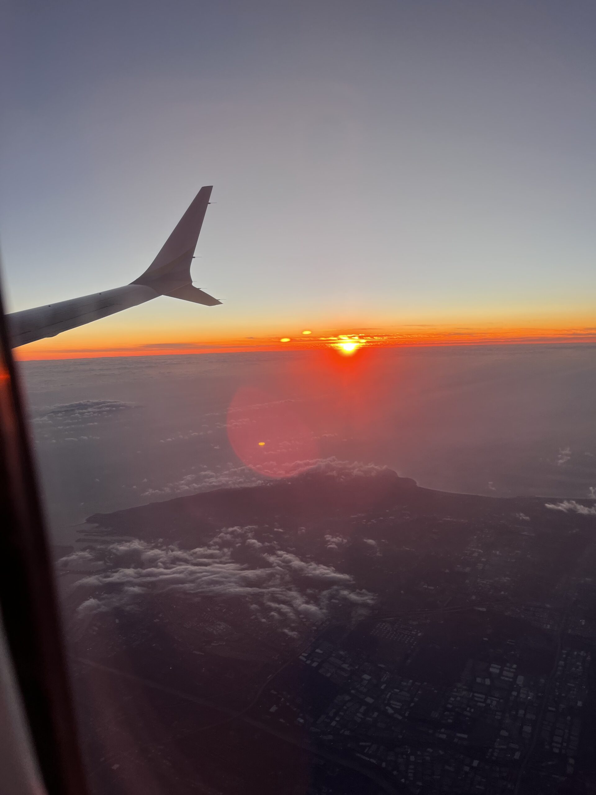 Sunset over the wing of an airplane.