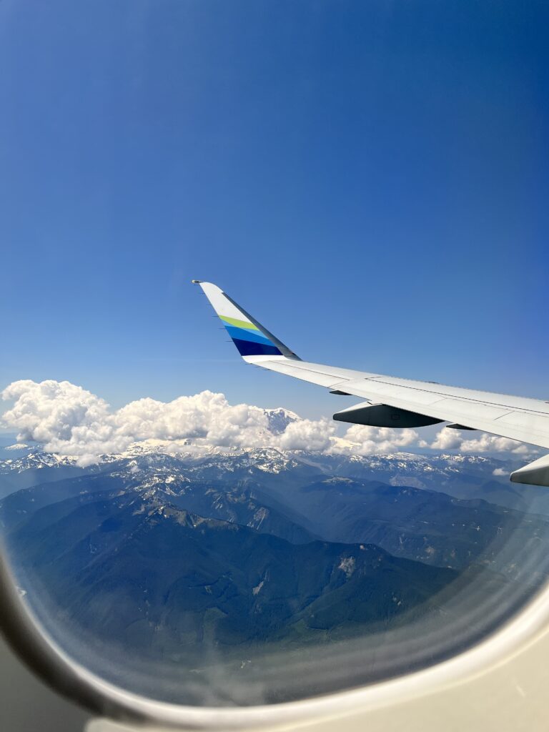 A view of Mount Rainier through an airplane window.