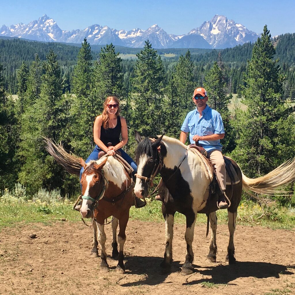 Megan, a family and leisure travel agent, rides horses with her husband.